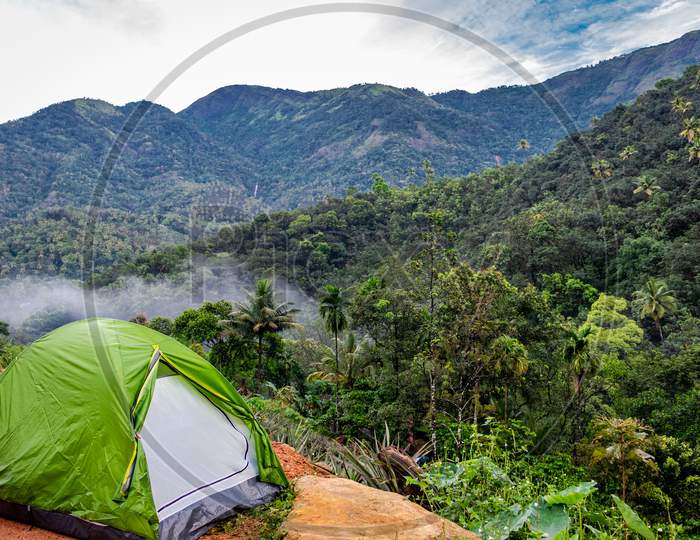 Camping In Forest With Tent And Forest View