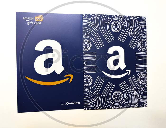 Amazon gift card isolated on white background with space for text, which allows the recipient to purchase items from the Amazon.com website