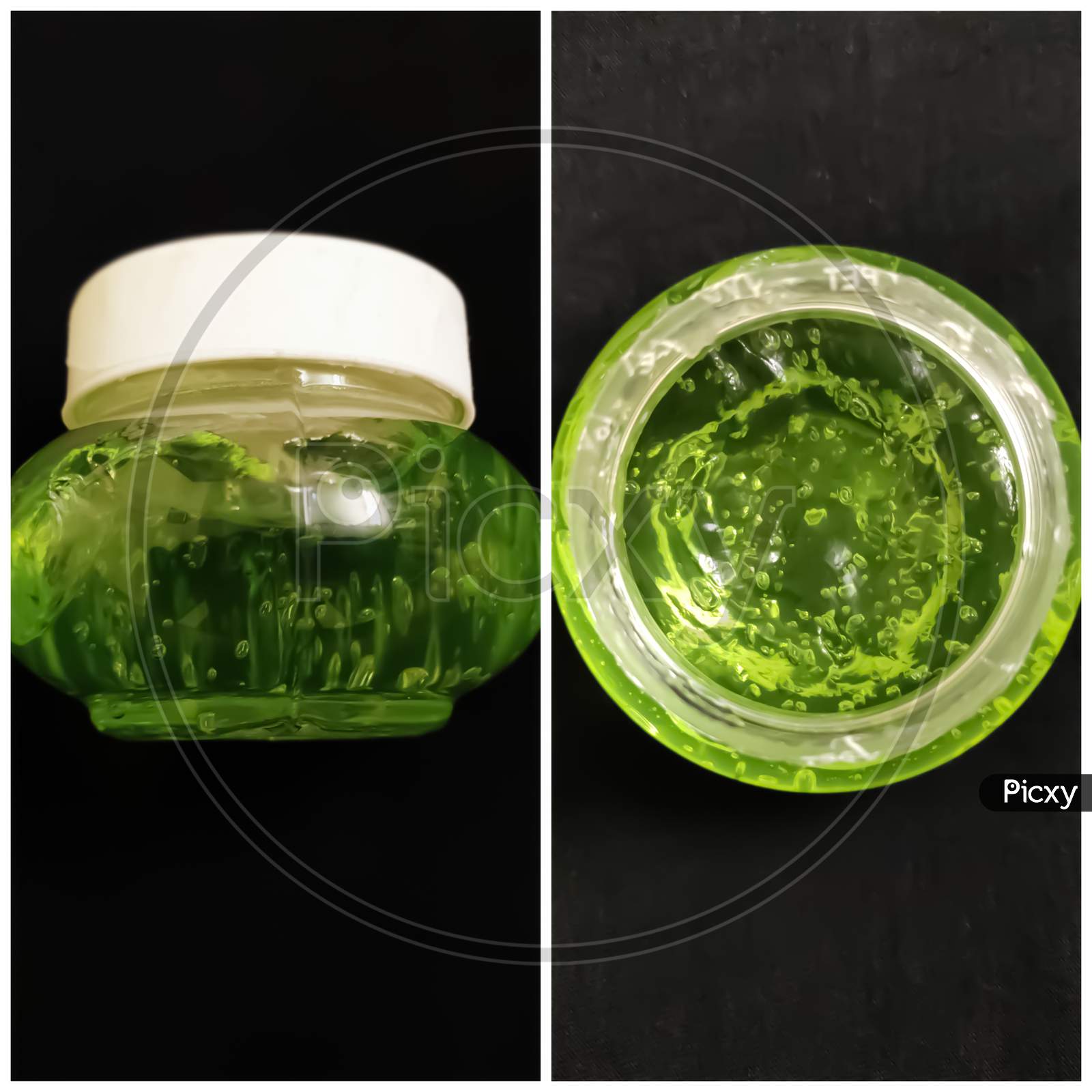 Aloe Vera gel in glass jar with black background