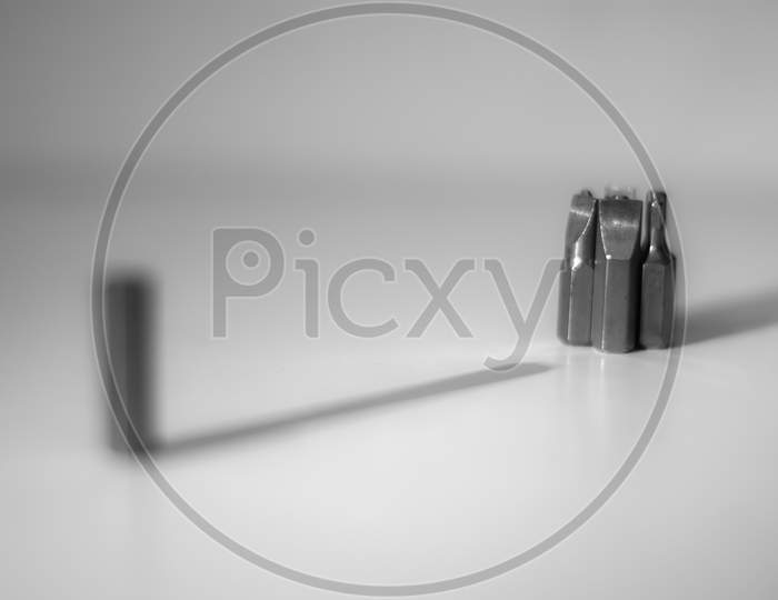 Different types of screw bits of screwdriver isolated on white background.
