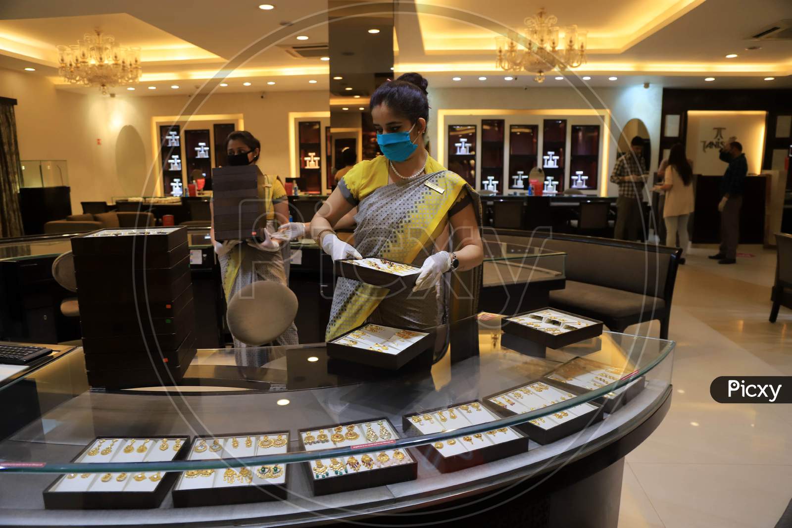 A Sales Girl  Arranges Jewellery At A Shop After  Authorities Allowed Shopkeepers To Open Their Establishments With Certain Restrictions During Coronavirus or COVID-19 Pandemic in Prayagraj, May 20,2020