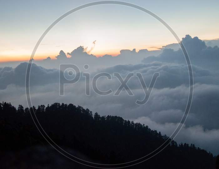 Mountain above clouds