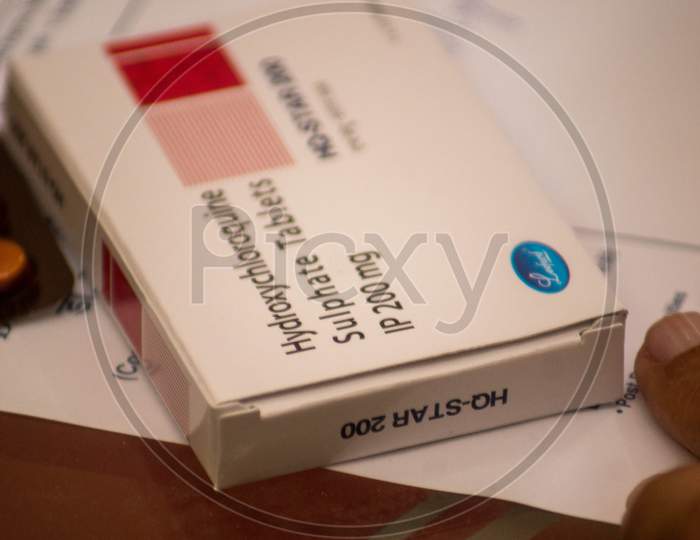 A Box Of Hyroxychloroquine Tablets On A Prescription Paper