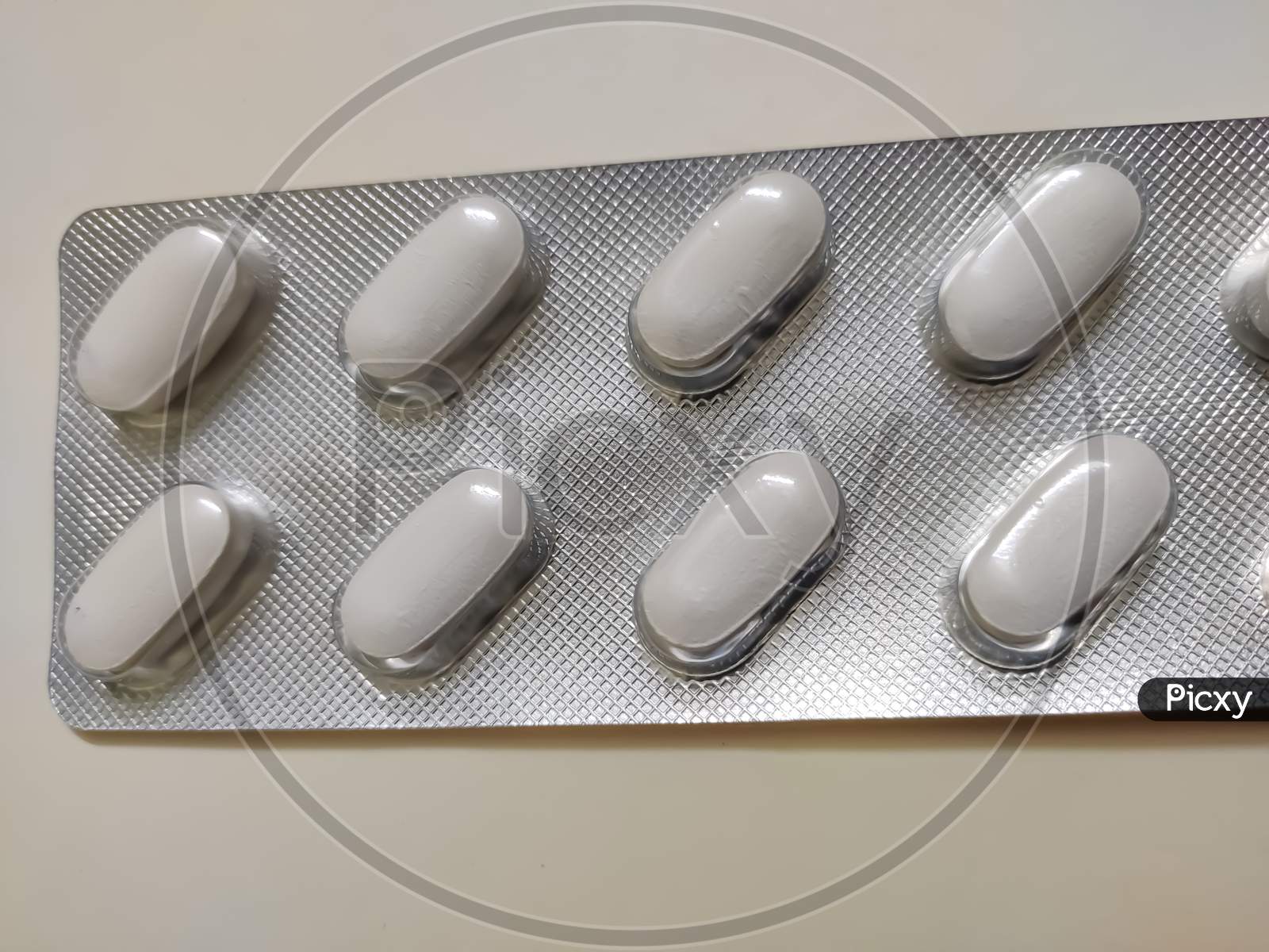 Blister packs antibiotics and pills top view. White drug blister packaging