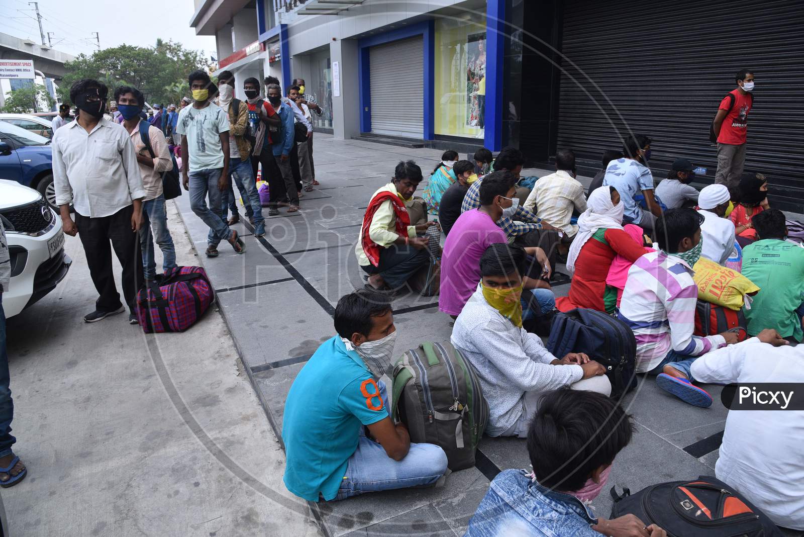 Migrant Workers from Bihar, Jharkhand and UP wait to get registered from Cyberabad Police to get onto a Shramik Special Train during ongoing Nationwide Lockdown amid Coronavirus Pandemic, Kukatpally,Hyderabad, May 19,2020.