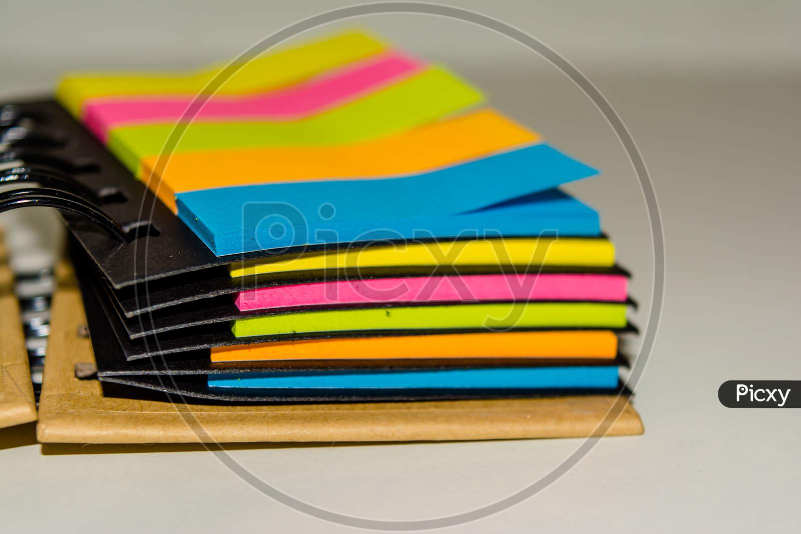 spiral notebook of sticky notes on isolate white background.