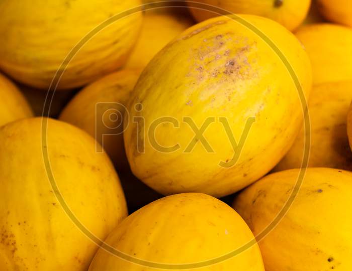 Yellow Rind Melons In The Market Fresh Fruit.