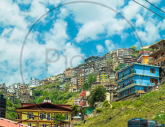 Shimla, Himachal Pradesh, India - July 18Th, 2019: View Of Residential Neighborhood Built On A Hill On A Sunny Day