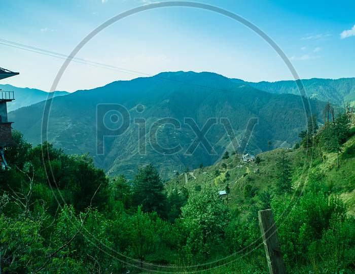 Landscape Of Mountains With Forest Trees All Around Daytime