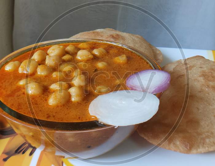 Chole Poori receipe in a dish. Traditional receipe Chole Puri in a bowl. Chickpeas receipe in a bowl.