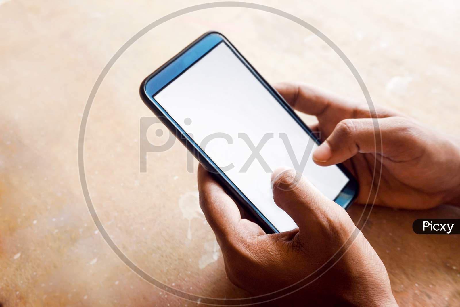 hand holding smart phone with white screen