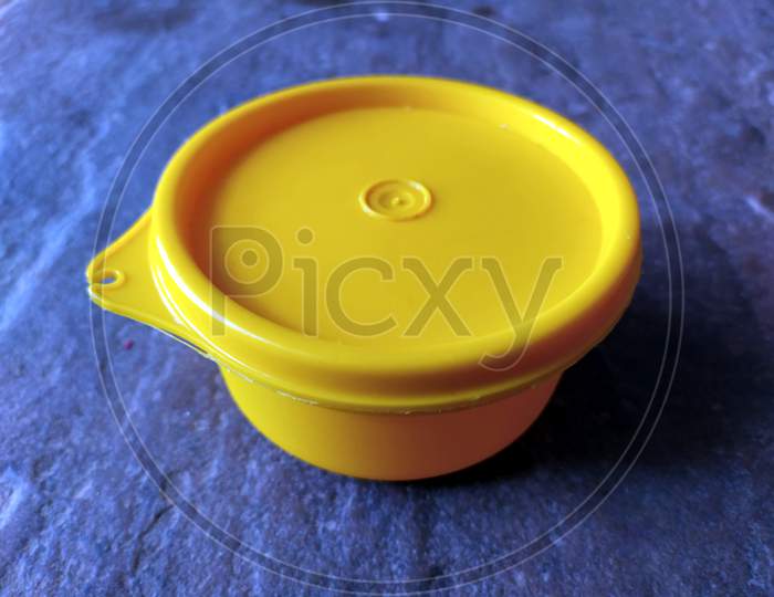 Download Image Of Yellow Plastic Container Box On Stone Background Fq970542 Picxy PSD Mockup Templates