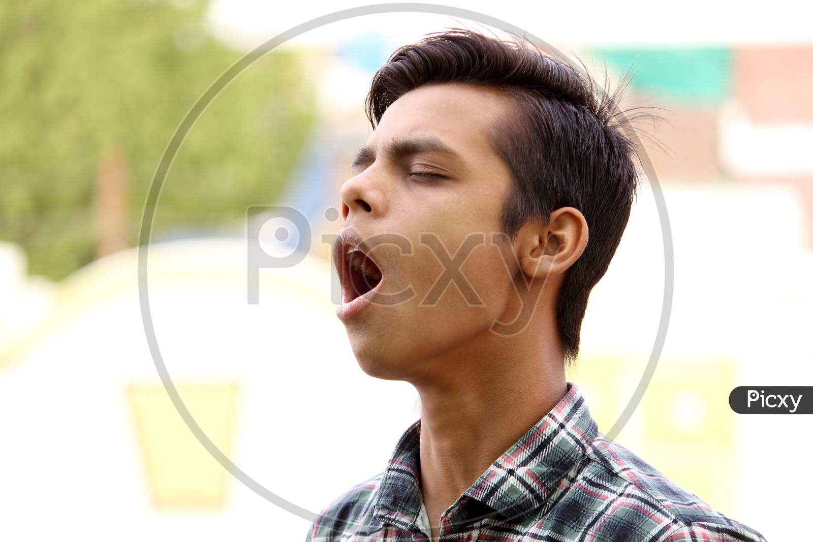 portrait of funny guy, Asian boy yawning with funny style open mouth