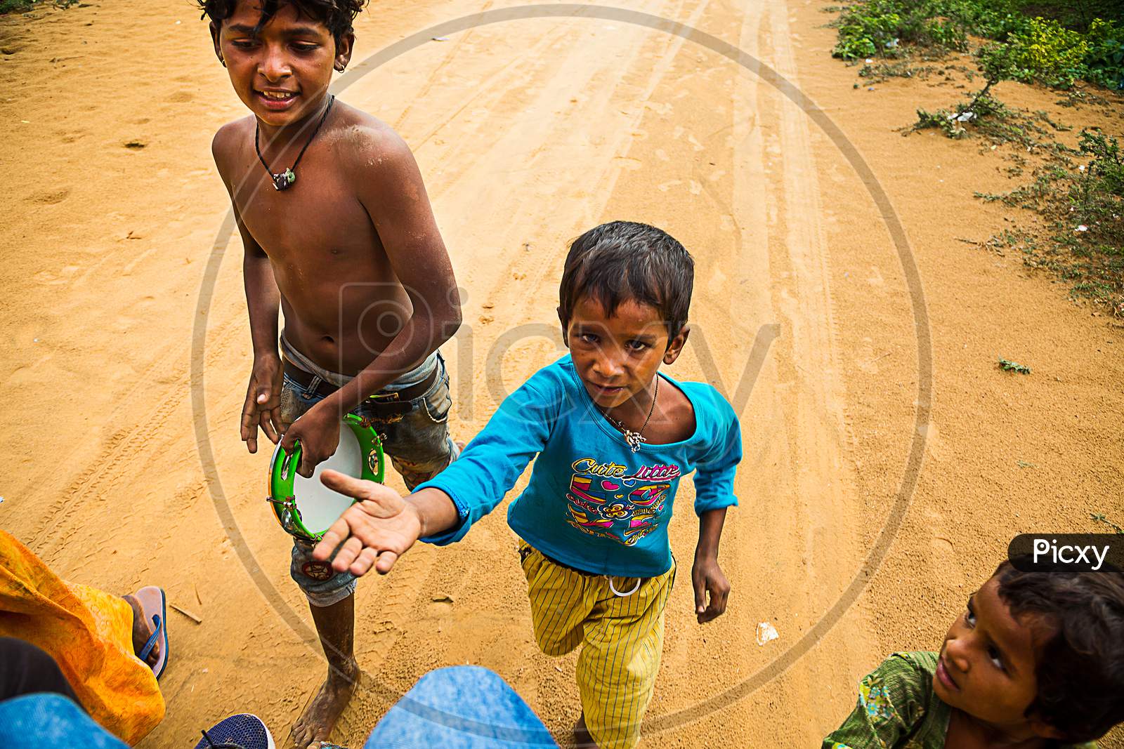Hyderabad, India - June 18Th, 2019: Poor Helpless Beggar Children Running And Begs For Food And Money From Tourist, Poverty Is A Major Issue In India.