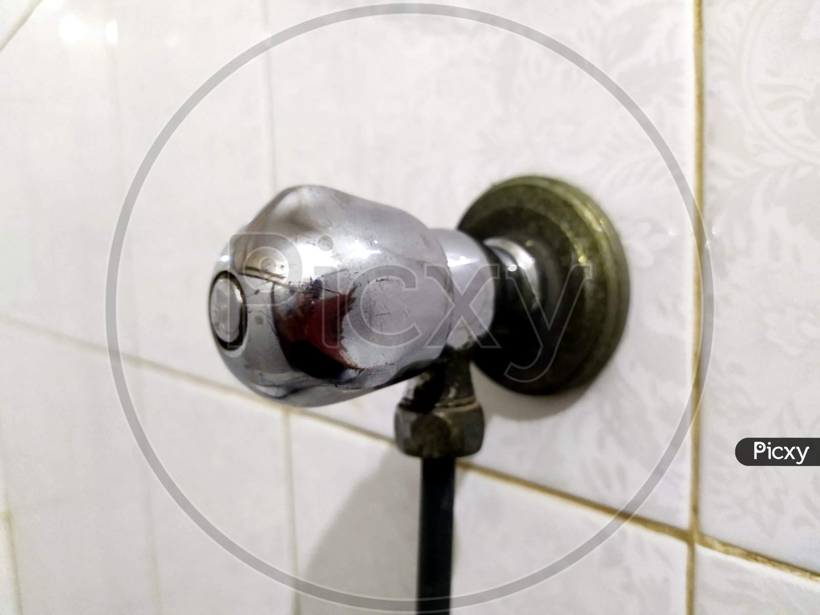 steel tap in bathroom wall