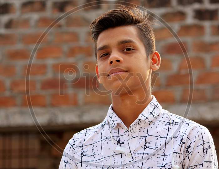 closeup portrait of teen age Asian guy looking,