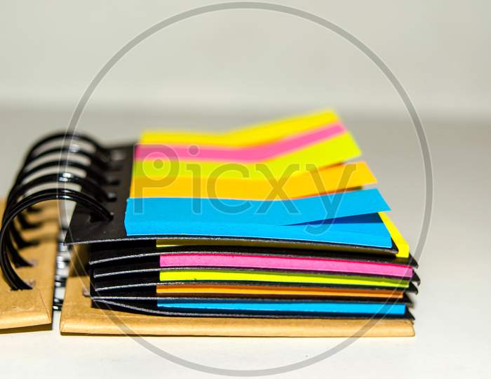spiral notebook of sticky notes on isolate white background.