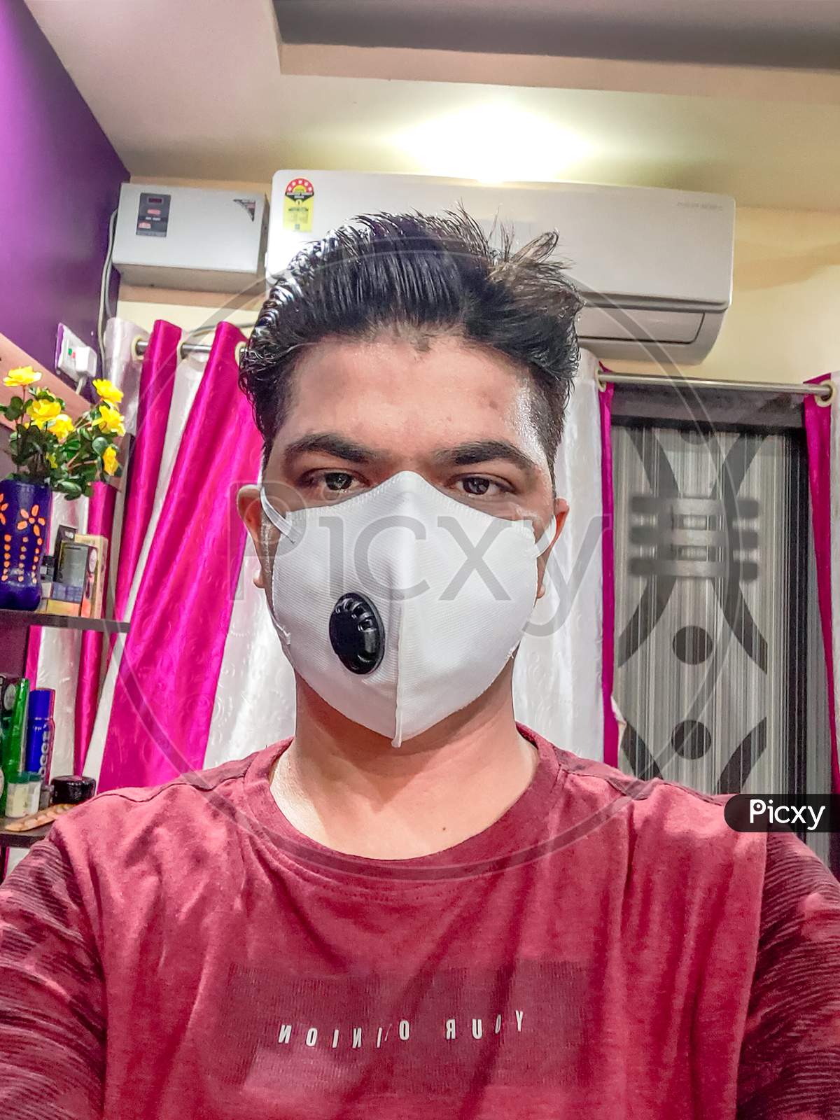 Wearing N 95 Mask And Staying At Home To Protect From Corona Virus.