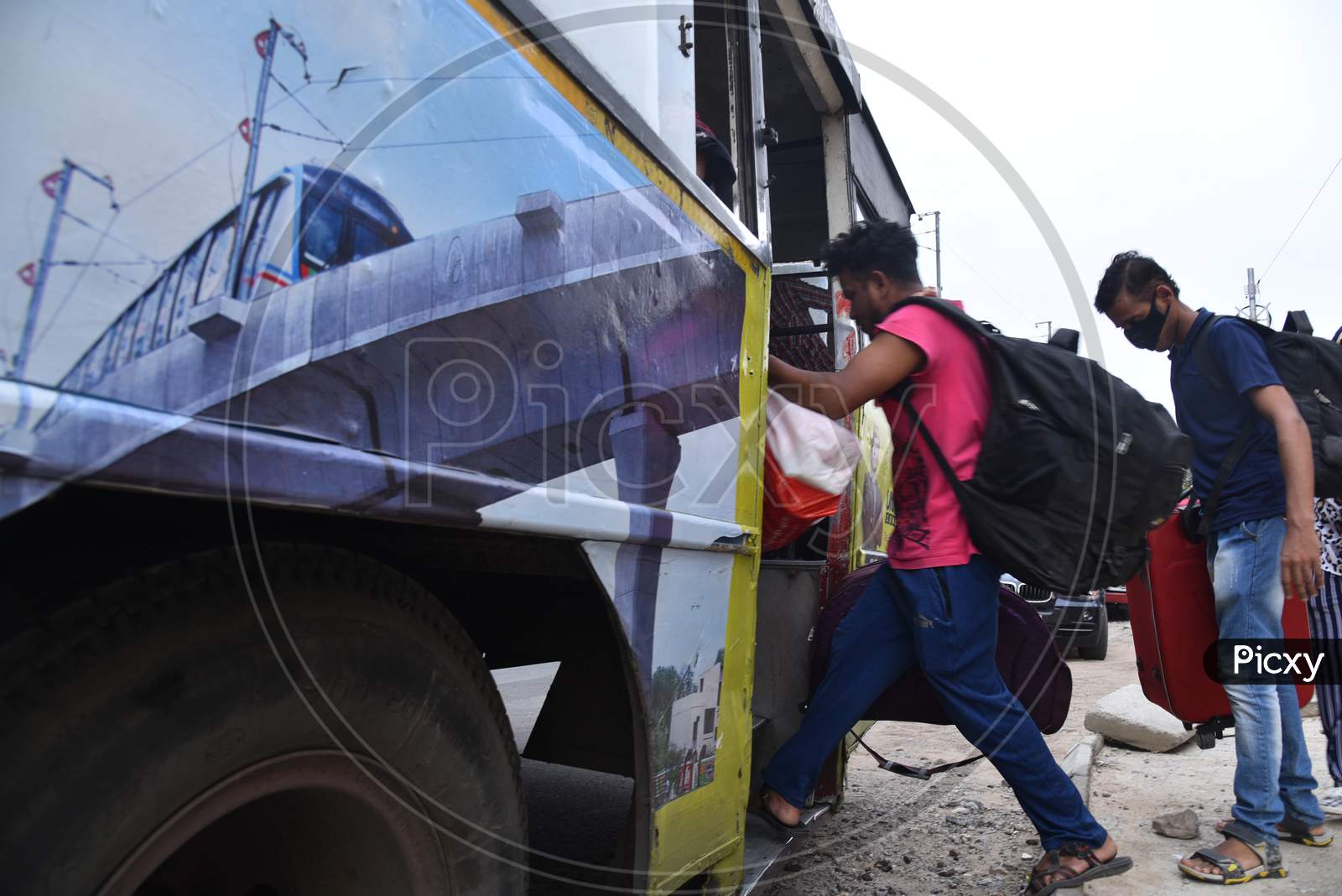 Migrant Workers from Bihar, Jharkhand and UP board a bus after  registering from Cyberabad Police to get onto a Shramik Special Train during ongoing Nationwide Lockdown amid Coronavirus Pandemic, Kukatpally,Hyderabad, May 19,2020.