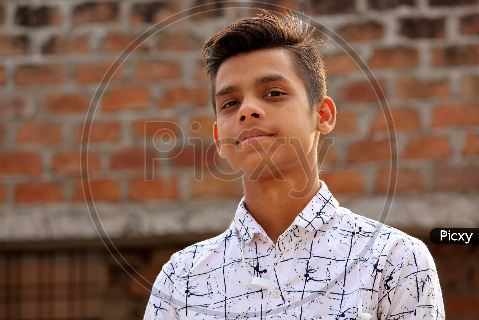 closeup portrait of teen age Asian guy looking,