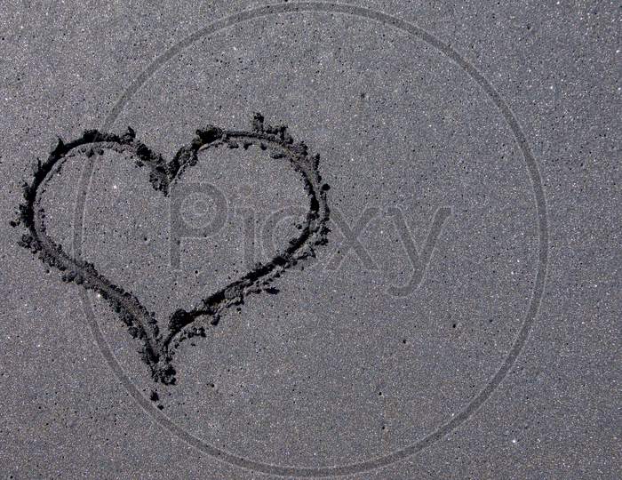 Heart Shape Drawn On Black Sand Beach