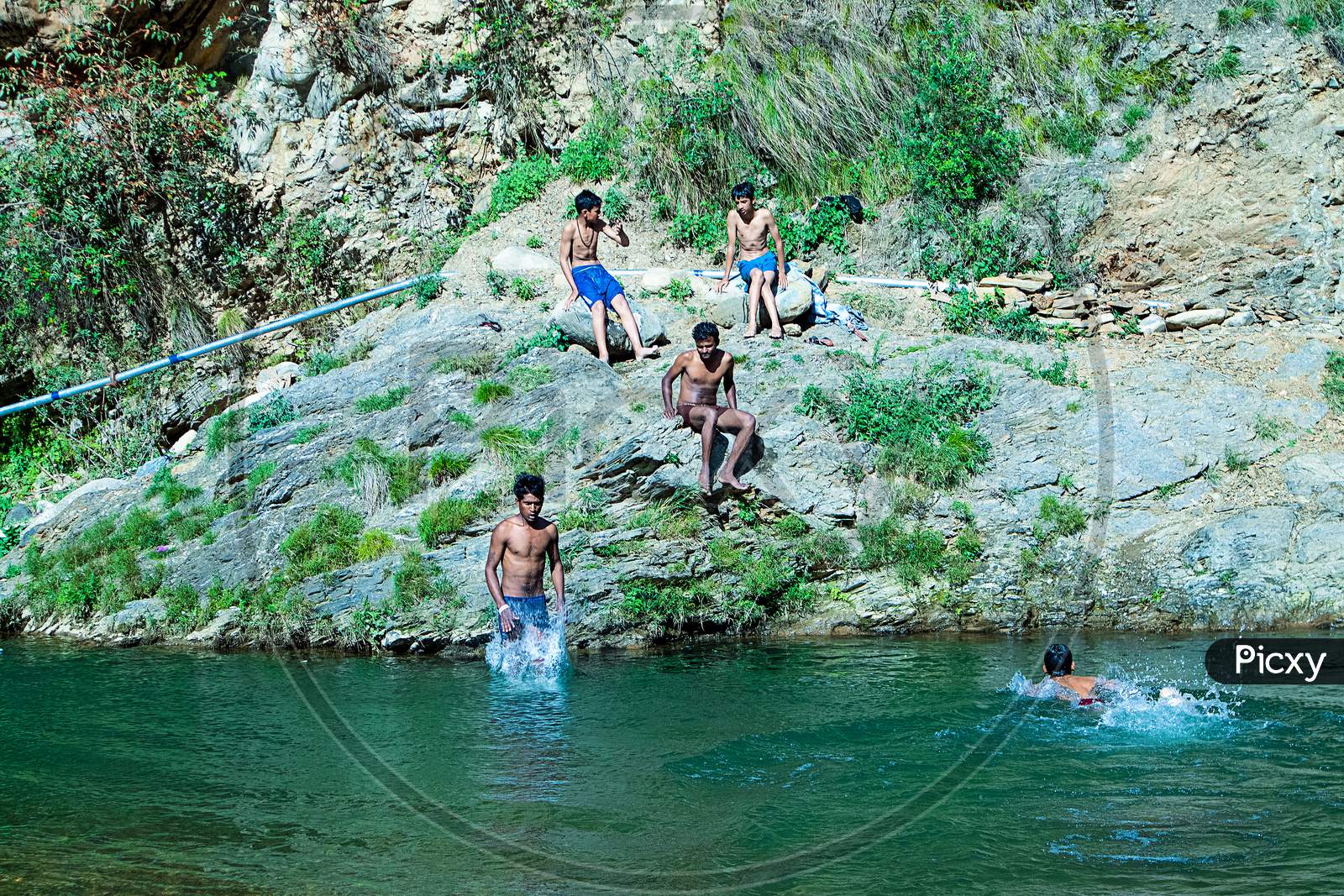 Nehrwa, Himachal Pradesh, India - April 20Th, 2019: Boys Swimming In Fresh River Water On A Summer Vacations