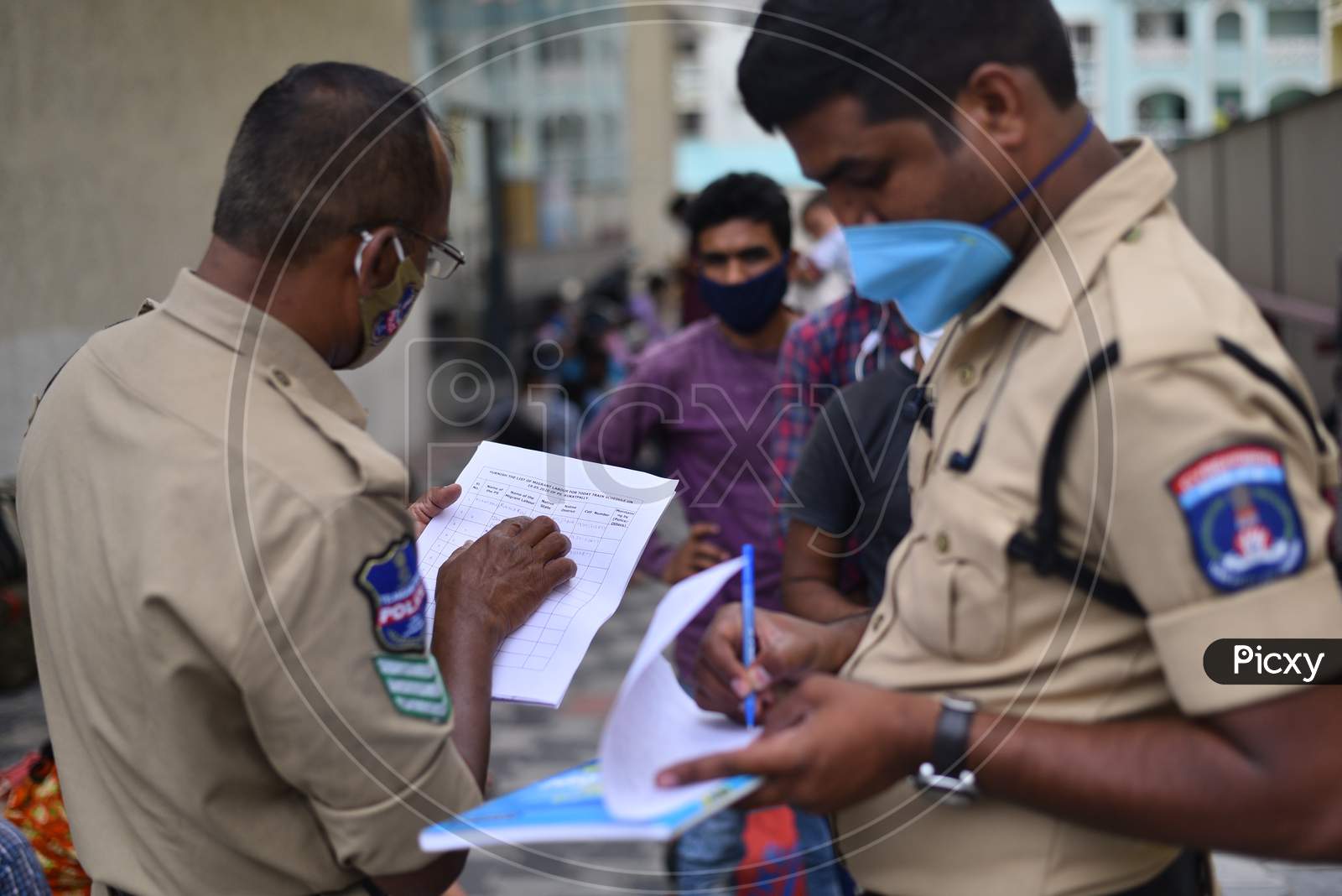 Cyberabad Police register the Migrant Workers from different states so that they can board a Shramik Special Train during an ongoing Nationwide Lockdown amid Coronavirus Pandemic, Kukatpally,Hyderabad, May 19,2020