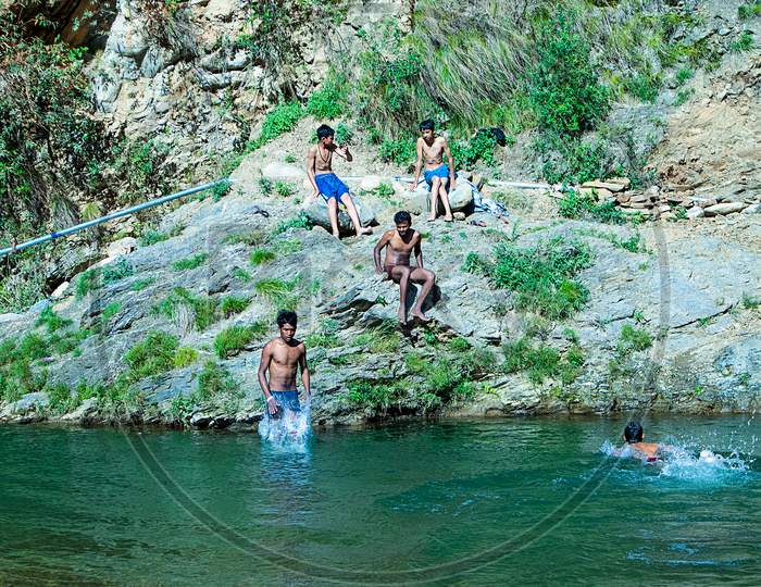 Nehrwa, Himachal Pradesh, India - April 20Th, 2019: Boys Swimming In Fresh River Water On A Summer Vacations