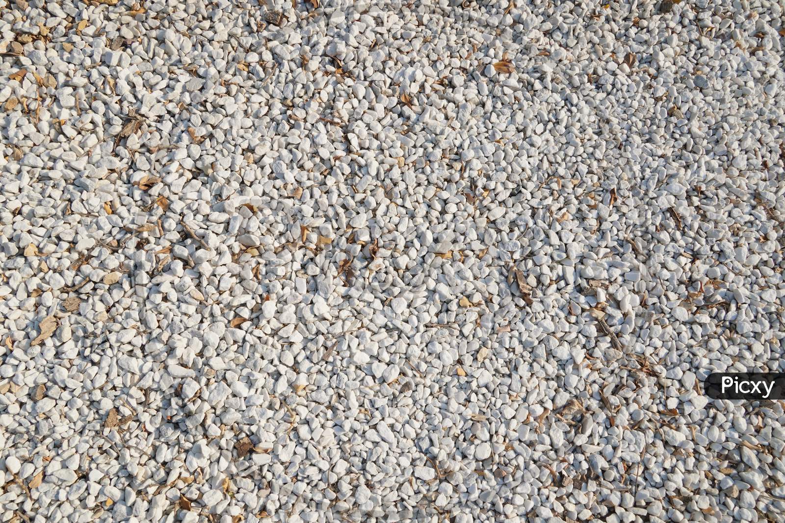 White And Brown Pebble Stone Texture For Background. The Texture Of Brown Gravel Stones.