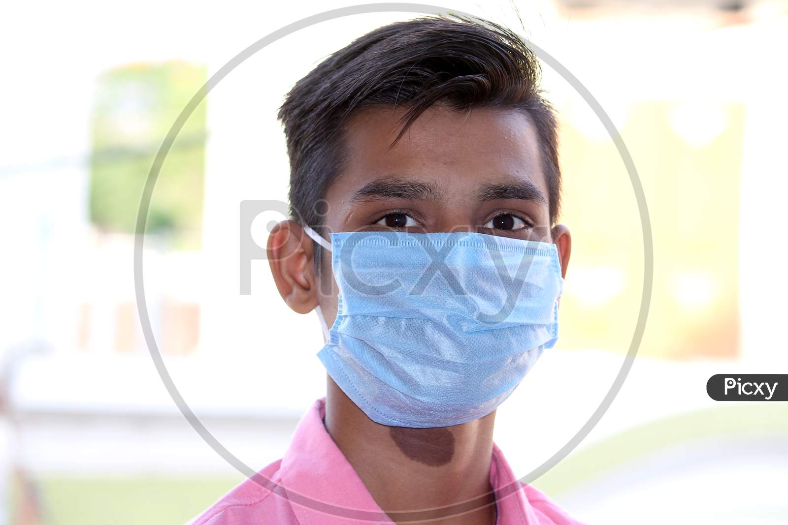 Image of portrait of unhappy Indian guy with wear protective mask on ...