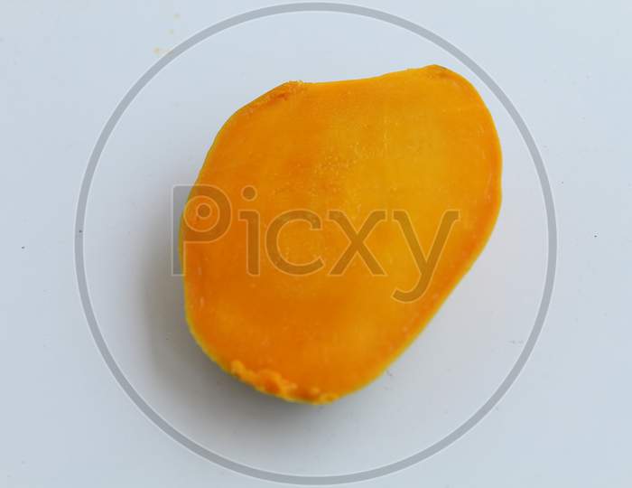Juicy ripe Mango slice isolated