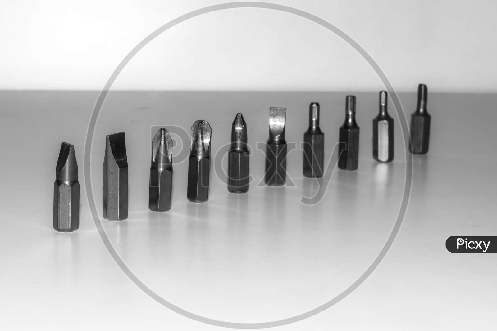 Different types of screw bits of screwdriver isolated on white background.
