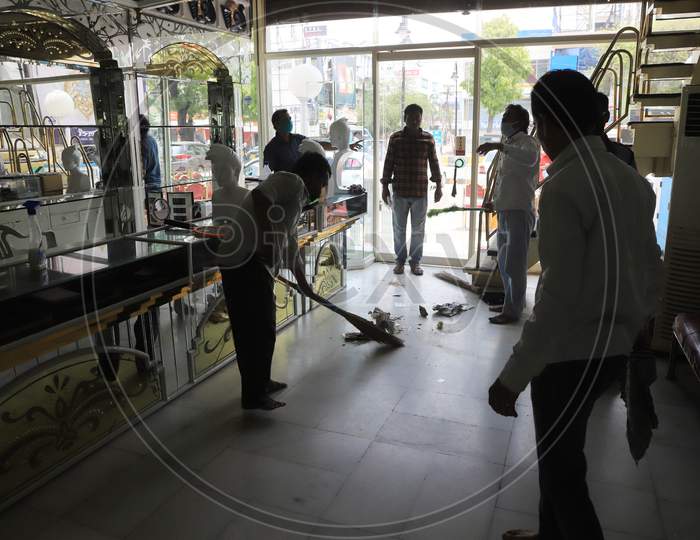 Workers Sanitise The Shop  After  Authorities Allowed Shopkeepers To Open Their Establishments With Certain Restrictions During Coronavirus or COVID-19 Pandemic in Prayagraj, May 20,2020