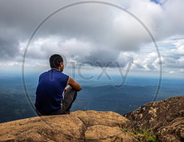 Man Isolated Watching Landscape From Hilltop
