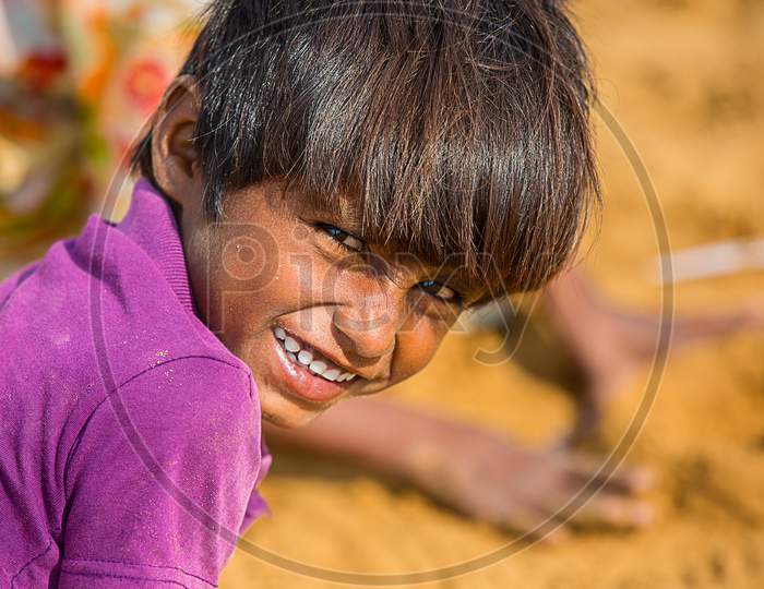 Jodhpur, Rajasthan, India - June 18Th, 2019: Closeup Poor Rural Boy Kid Smiling Towards Camera, Poverty Unprivileged Indian Children.