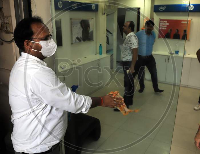 An Owner Cleans The Shop  After  Authorities Allowed Shopkeepers To Open Their Establishments With Certain Restrictions During Coronavirus or COVID-19 Pandemic in Prayagraj, May 20,2020