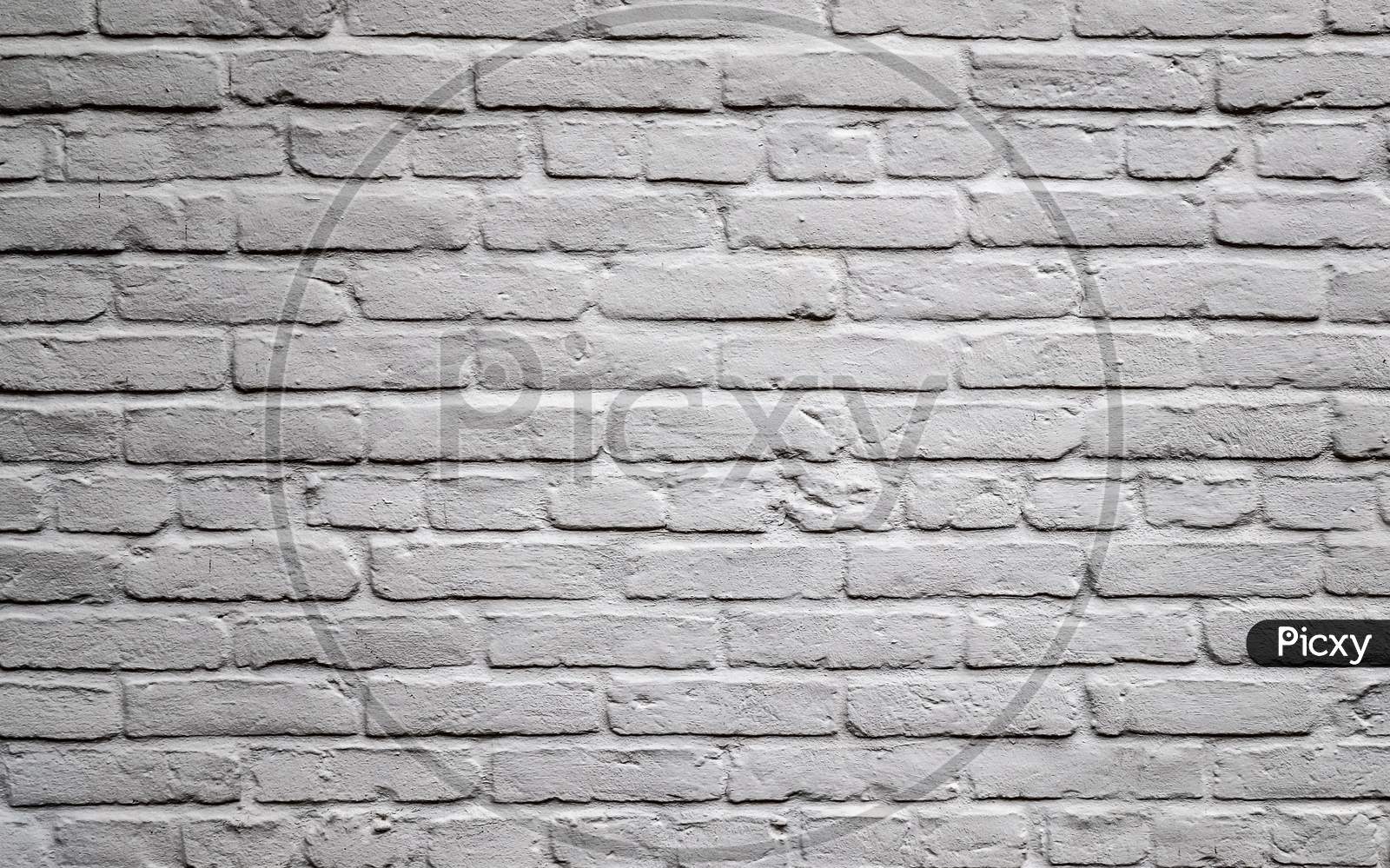 Colorful brick wall. Texture of old weathered historical brick wall panoramic background.