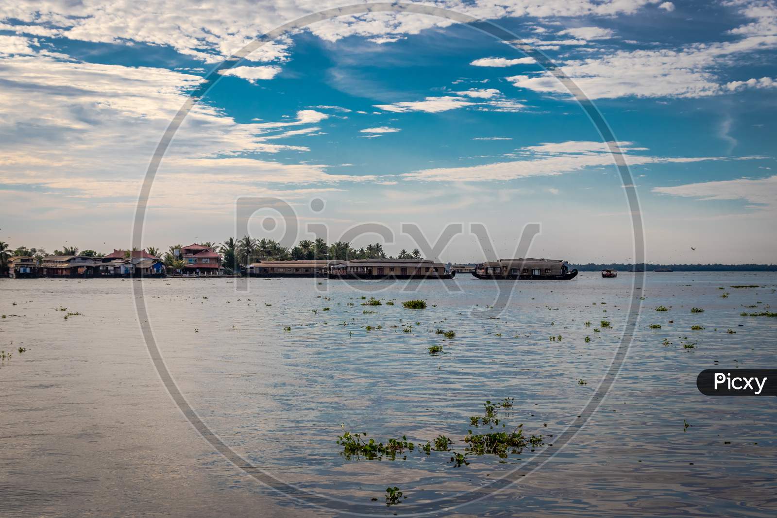 Backwater View With Houseboats And Blue Sky