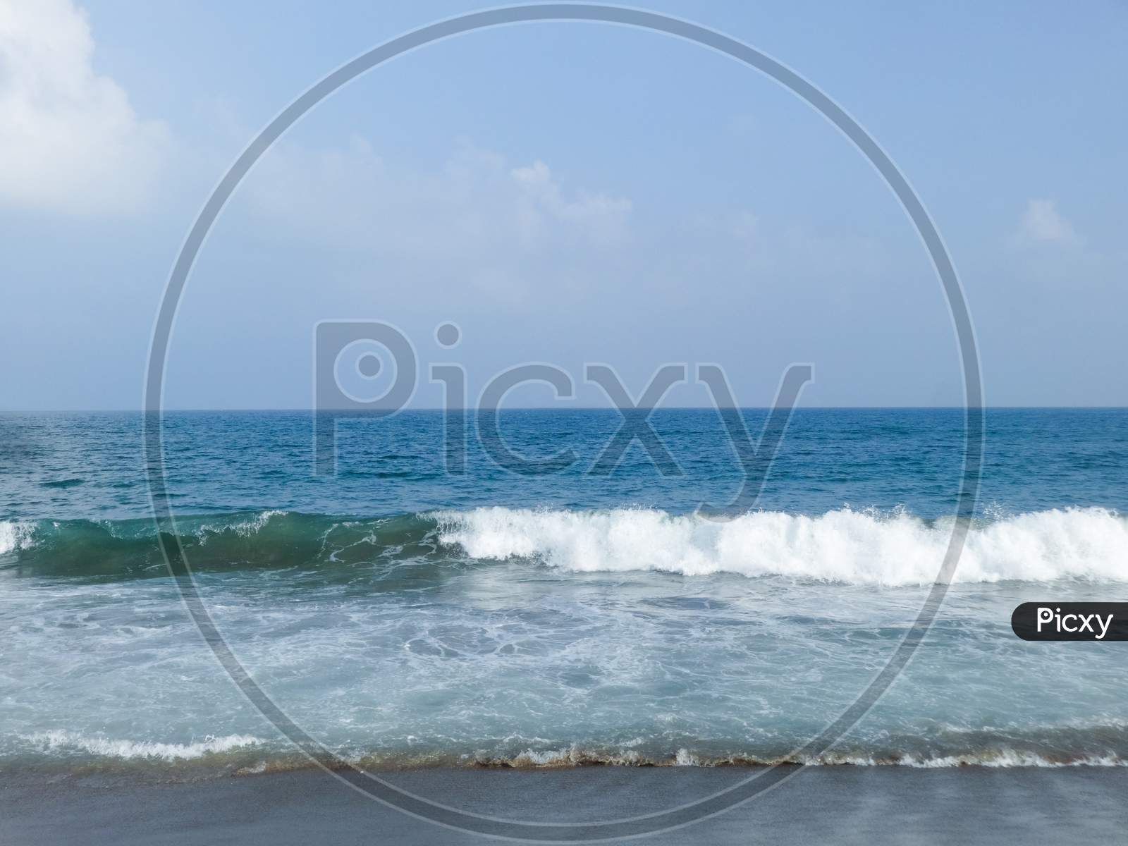 Beautiful blue ocean sea waves and blue sky background wallpaper