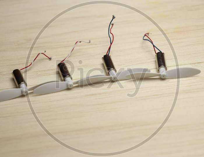 Coreless Motor Set Used In Drones With Propeller On Wooden Background