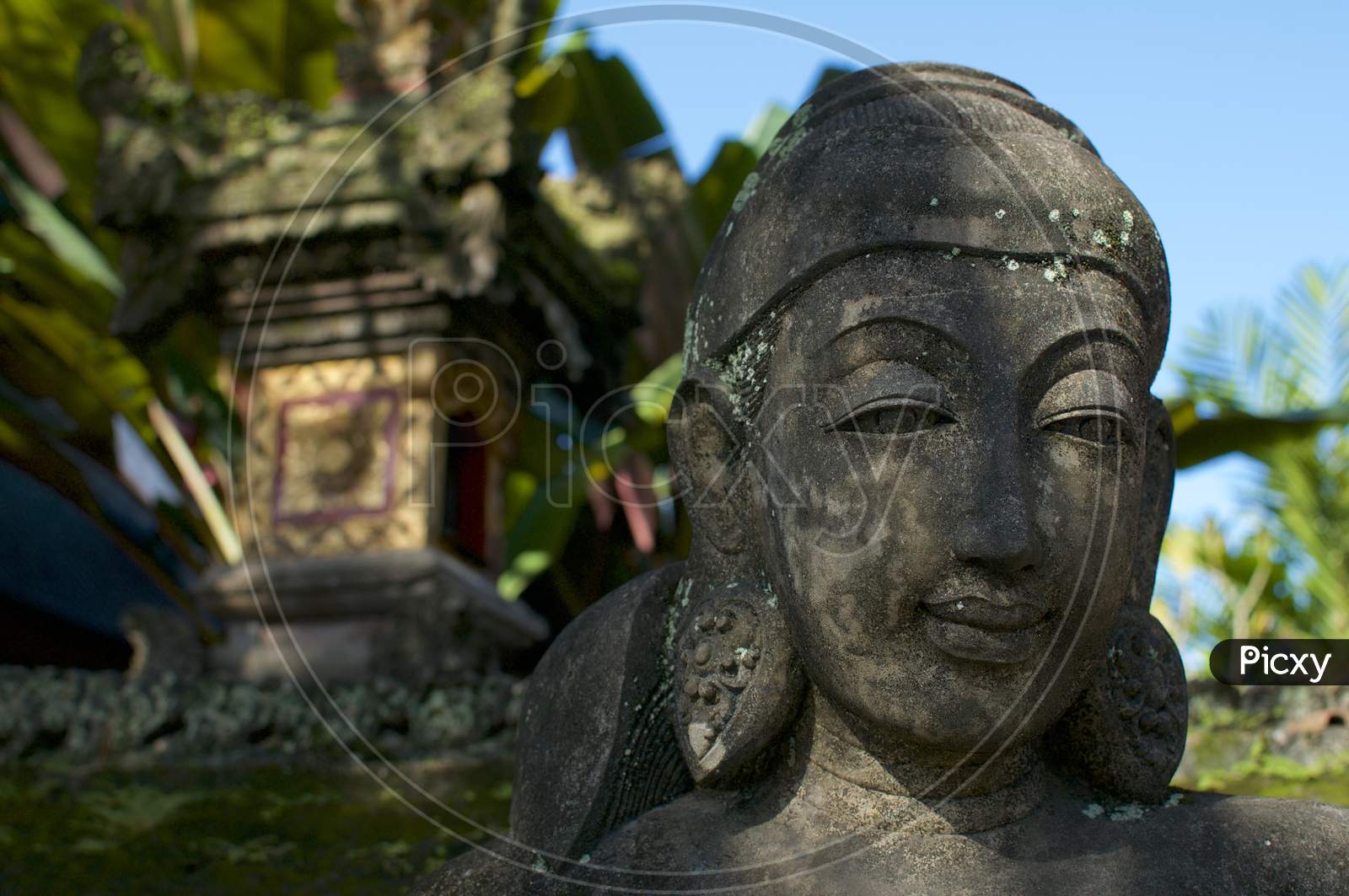Close Up Picture Of A Female Like Stone Statue In Bali