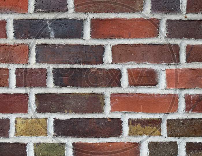 Colorful brick wall. Texture of old weathered historical brick wall panoramic background.
