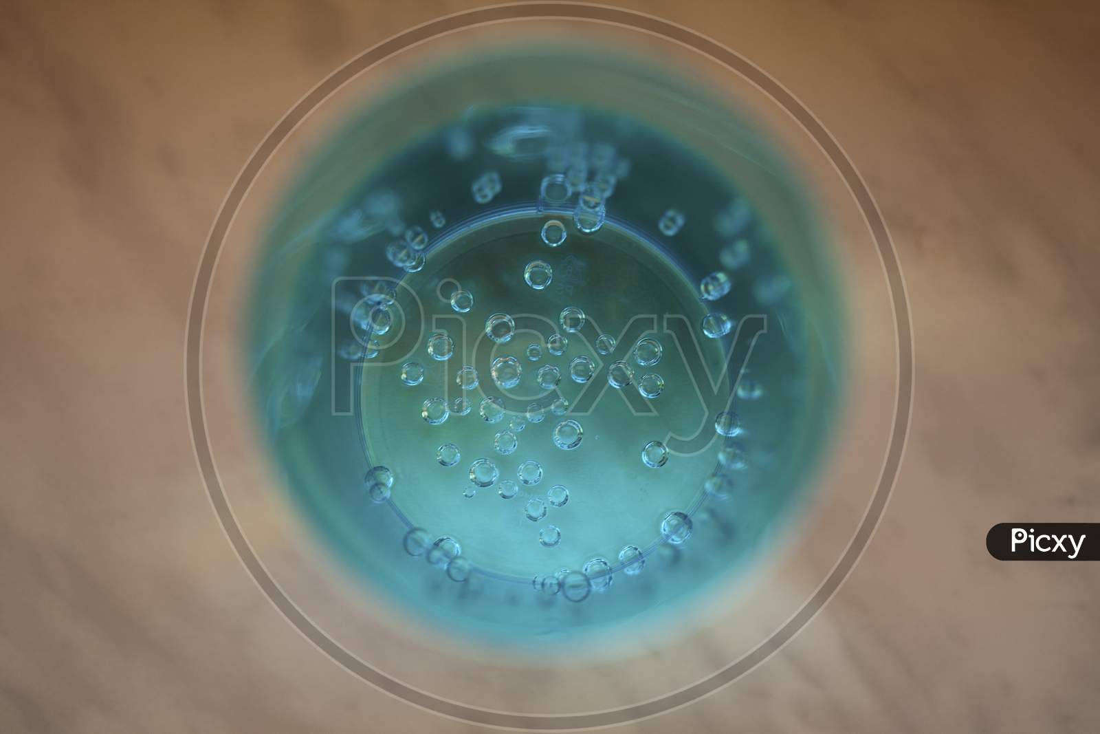 Close Up Bubbles In A Turquoise Glass