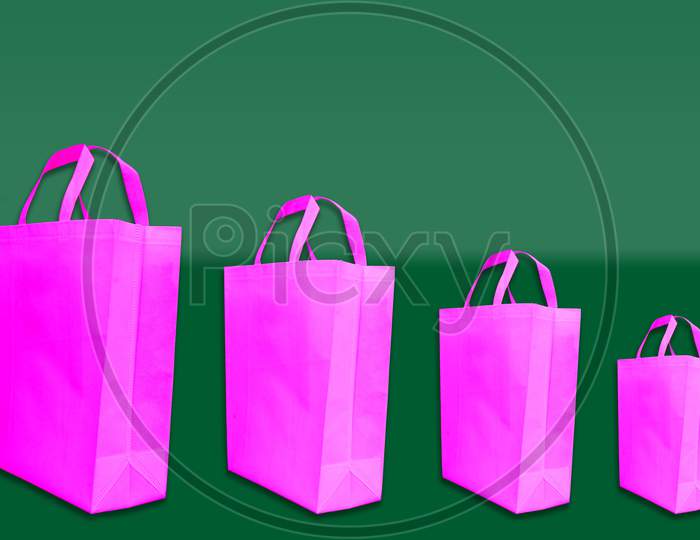 Pink color Non woven Handle loop bags on amazing background