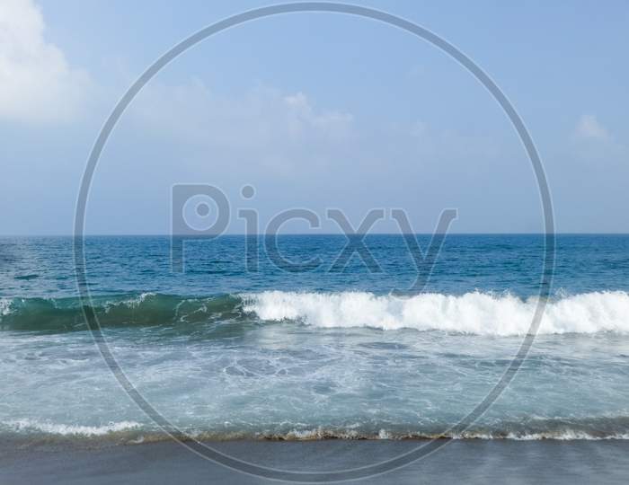 Beautiful blue ocean sea waves and blue sky background wallpaper