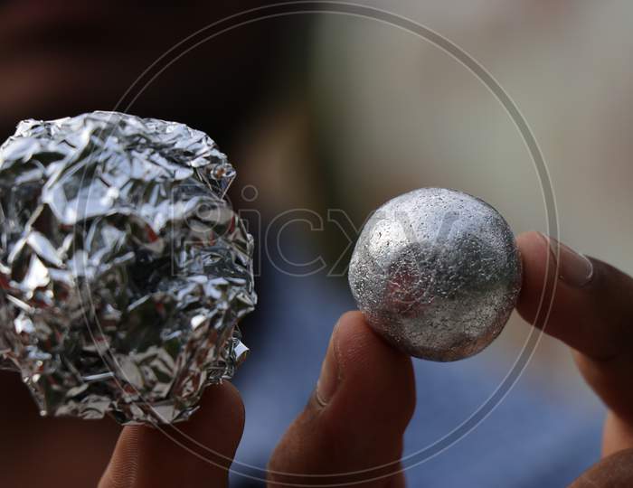 Kitchen Aluminium Foil Converted To Foil Ball Held In Hand