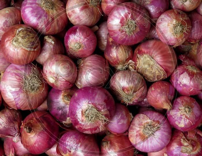 Isolated Red Onions,Red onions in market,onions at market ,Red onions on market stall,Closeup of Onions.Group Of Onions.