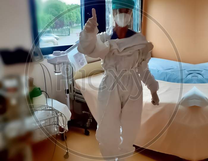 Photo Of Doctor Standing In Hospital Have Shallow Depth Of Field Selective Focus Blur And Wonderland Background Wearing Mask As Protective Instrument.