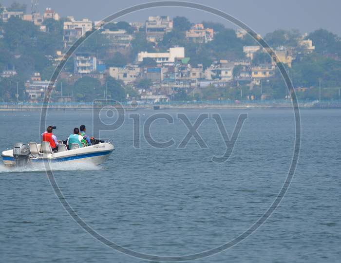 BHOPAL, MADHYA PRADESH, INDIA - NOVEMBER 20, 2019: Unidentified people riding boat during summer vacation in bhopal, Madhya Pradesh, India. Travel concept. Happy vacation.
