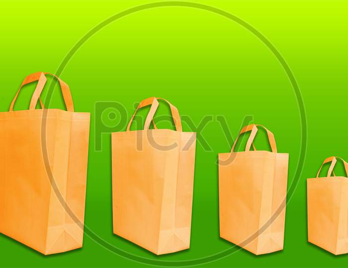 orange color Non woven Handle loop bags on amazing background